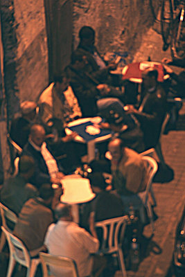 From my hotel roof, I took this at night with a telephoto lens of a typical (men only) Casablanca cafe scene; hence, it's fuzzy.