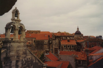 Another view of the trip bell tower with old Dubrovnik buildings down below.