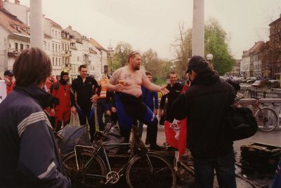 The workman with a beer (and a beer gut) was standing over an old bike and debris from the Ljubljanica River.