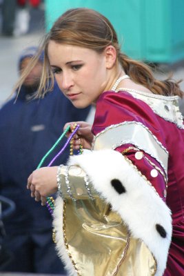 girl throwing beads