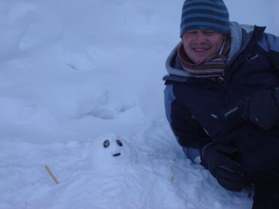 Michael and our snowman.JPG