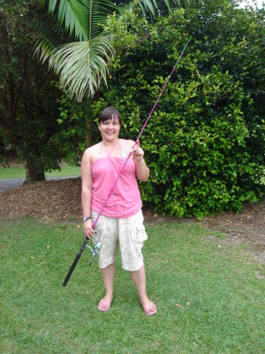 me and my new fishing rod.JPG