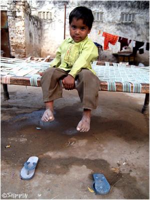 A boy outside his home, in a small village in Rajasthan.