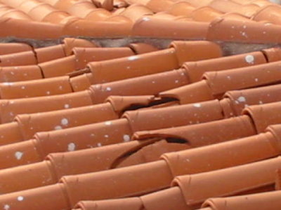 Cracked roof tiles after the quake