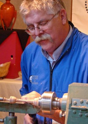 A craftsman works wood near Asheville