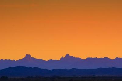 Distant Mountains At Sunrise