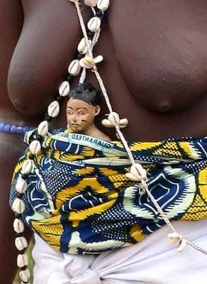 Voodoo. Mother who carries a small figure on her belly indicating that she had twins and one of them died.
