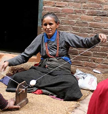 Lady spinning wool in Bhaktapur, Nepal.