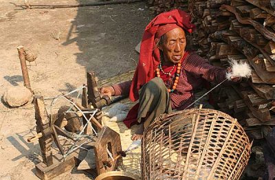 Lady spinning wool in Ghale Gaun, Nepal.