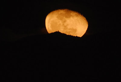 The Past Blue Moon rising behind Copernicus Peak