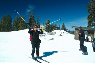 Susan Celebrating skiing to the top of the mountain