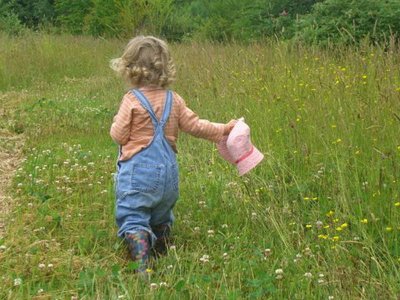 Little Girl Walking in Grass