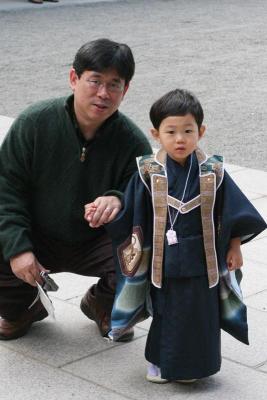 a young boy being presented for a blessing