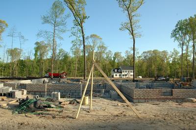 House front with view of neighbor's lot