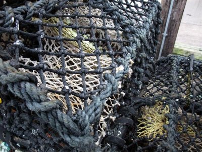 Seahouses lobster pots and fishing boats