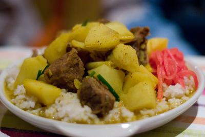 Curried yak with potatoes and rice.
