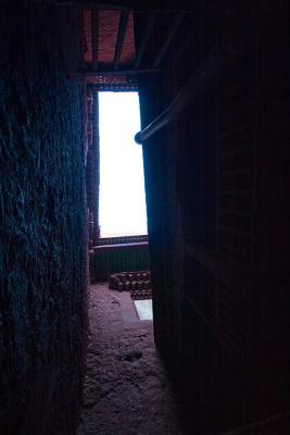 Cool mixure of blue light from the sky and red walls of the palace, in between chapels.