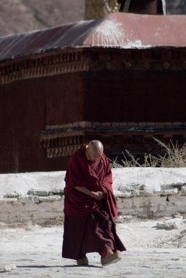 An old monk in front of one of the chapels.