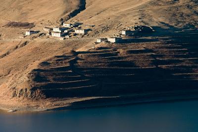Small village with terraced fields on the edge of the lake.