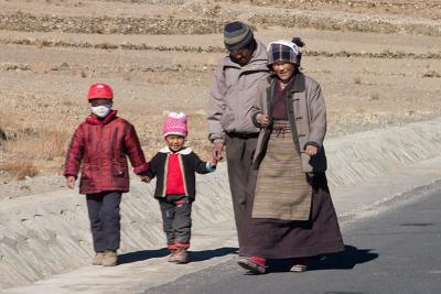 A family walking along the road.