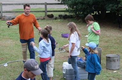 Ke shows kids how to make crawfish earrings