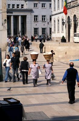 253 030401 Woman with Heavy Hats, Coimbra.JPG