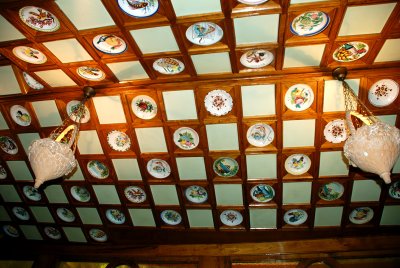 The restaurants ceiling is covered in hundreds of these little plates