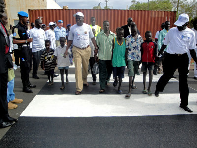 One of the politicians Instructing the kids on using the Zebra crossing