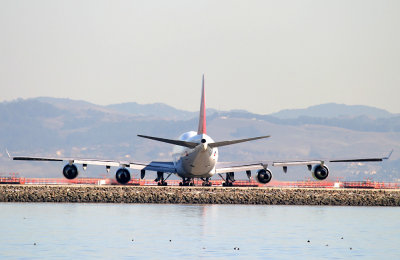 Turning  from taxiway foxtrot to hold short of runway 28L