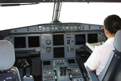 Cockpit and female First Officer.