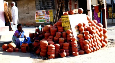 A lady selling earthern pots for Pongal