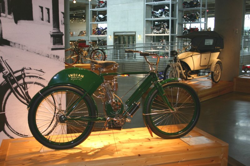 Early Indian with modern machines in the background