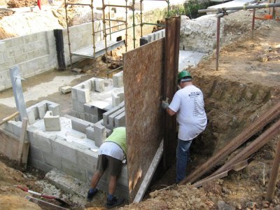 Shuttering and sheet piling to backfill hole for excavator access