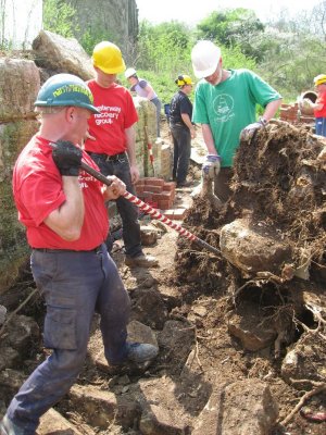 Removing the forebay stonework from the stump roots