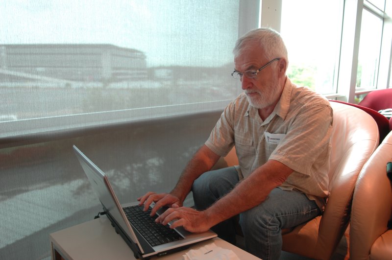 At the Qantas lounge sending the almost daily email