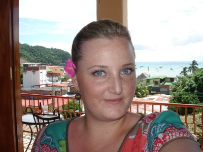 on the deck with flowers in her hair