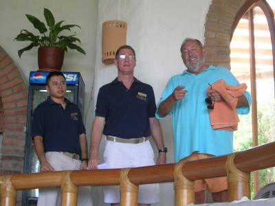Chris Berry, owner of Pelican Eyes, resort and restaurant ,is in the middle