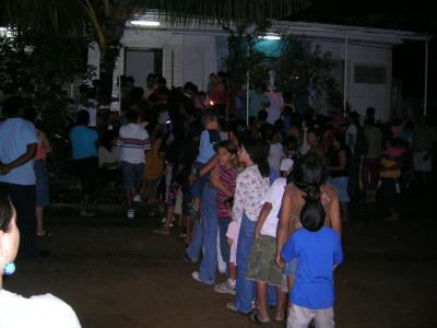 neighborhood children lining up for their gift