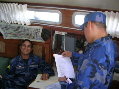 Sargent Hernadez and helper checking papers and boat... all was in order