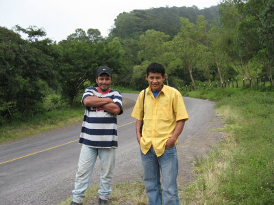two guys wondering why all us gringos were climbing on the tank