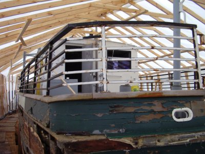 Aft deck with cabin.  I get a kick out of the building placed around the boat.