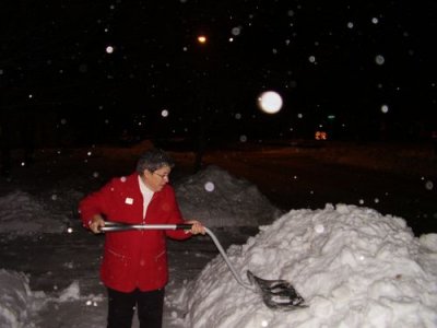Carefully placing the snow.
