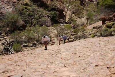 DES SLOGGING UPHILL IN THE OLGAS,  NORTHERN TERRITORY