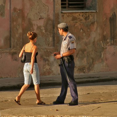 Policemans Eyes following Young  Woman