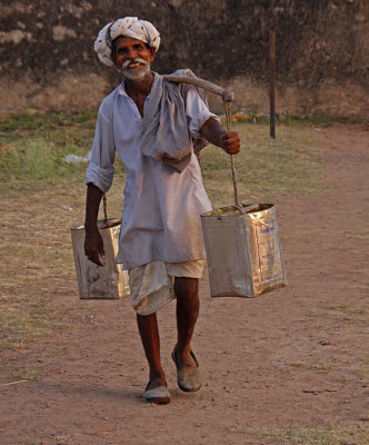 Man Carrying Water Buckets