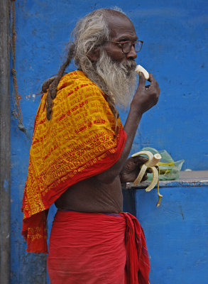 Holy Man Eating Banana