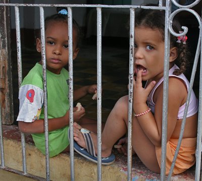 Two Girls Sitting in Window