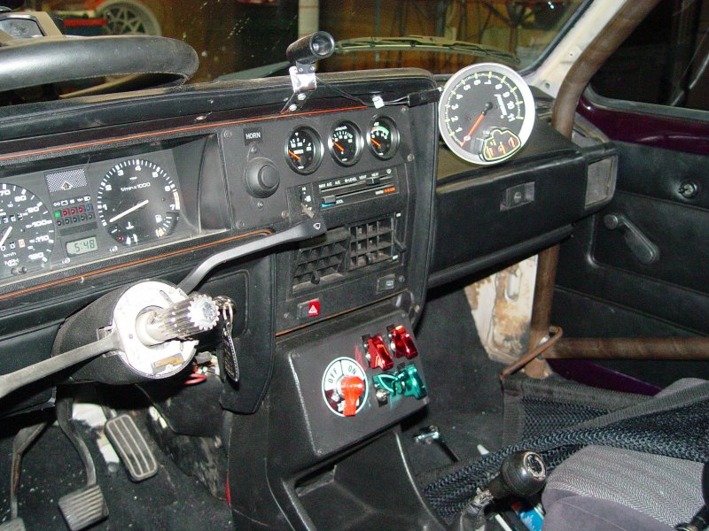 IVE ADDED NEW VDO GAUGES, COVERED SWITCHES, MASTER BATTERY KILL SWITCH, SHIFT LIGHT AND A TELL TALE TACHOMETER