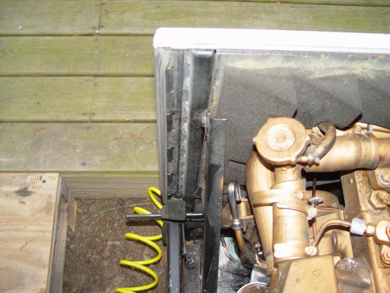 A HEAVY DUTY PIANO STYLE HINGE WAS USED TO ALLOW THE DOOR TO SWING OPEN AND CLOSE, IT IS AVAILABLE FROM McMASTER AND CARR