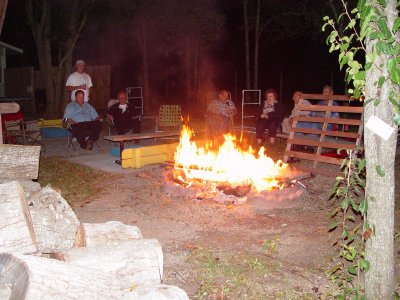 THE FIRE RING WAS ABLAZE WITH WOOD SUPPLIED BY TWIN OAKS
